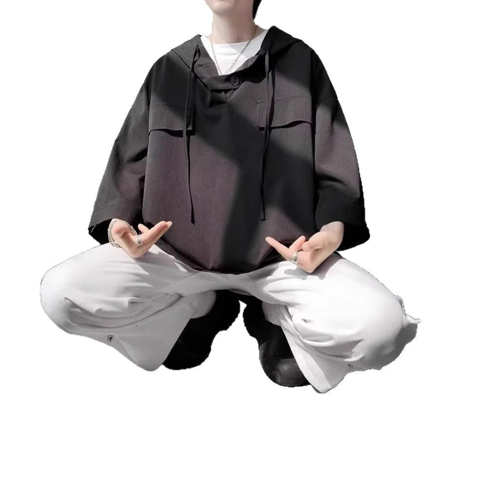 Men's hooded short sleeve t-shirt in loose fit available in multiple colours including black, white, and blue