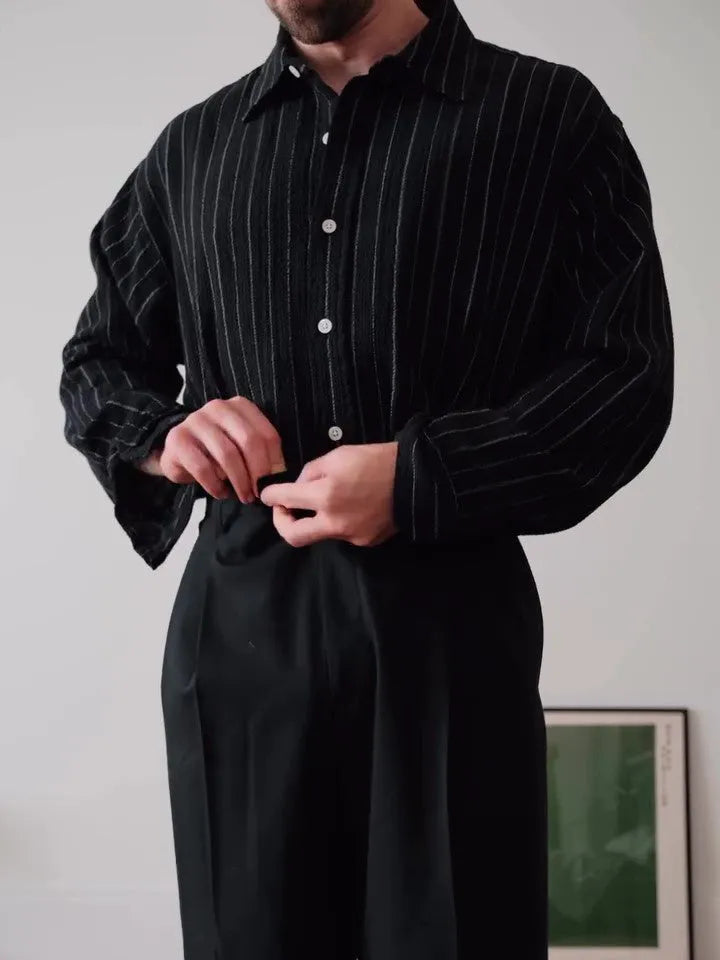 Black pinstriped polyester button-down shirt for men on a hanger, showing regular fit.