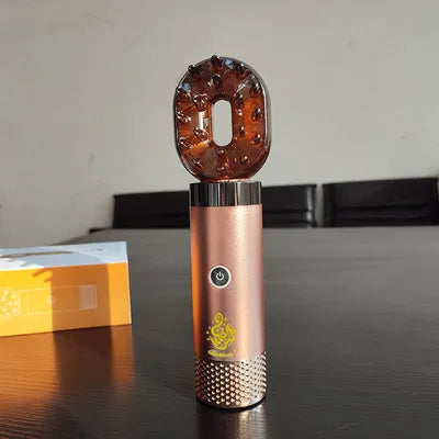 USB rechargeable Middle Eastern comb aromatherapy stove in silver, 14x5x4cm, on a car dashboard