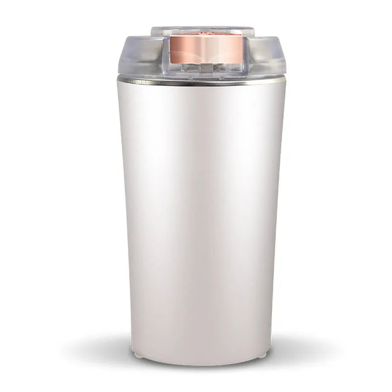 Blue mini flour mill and grain grinder appliance on a kitchen countertop.