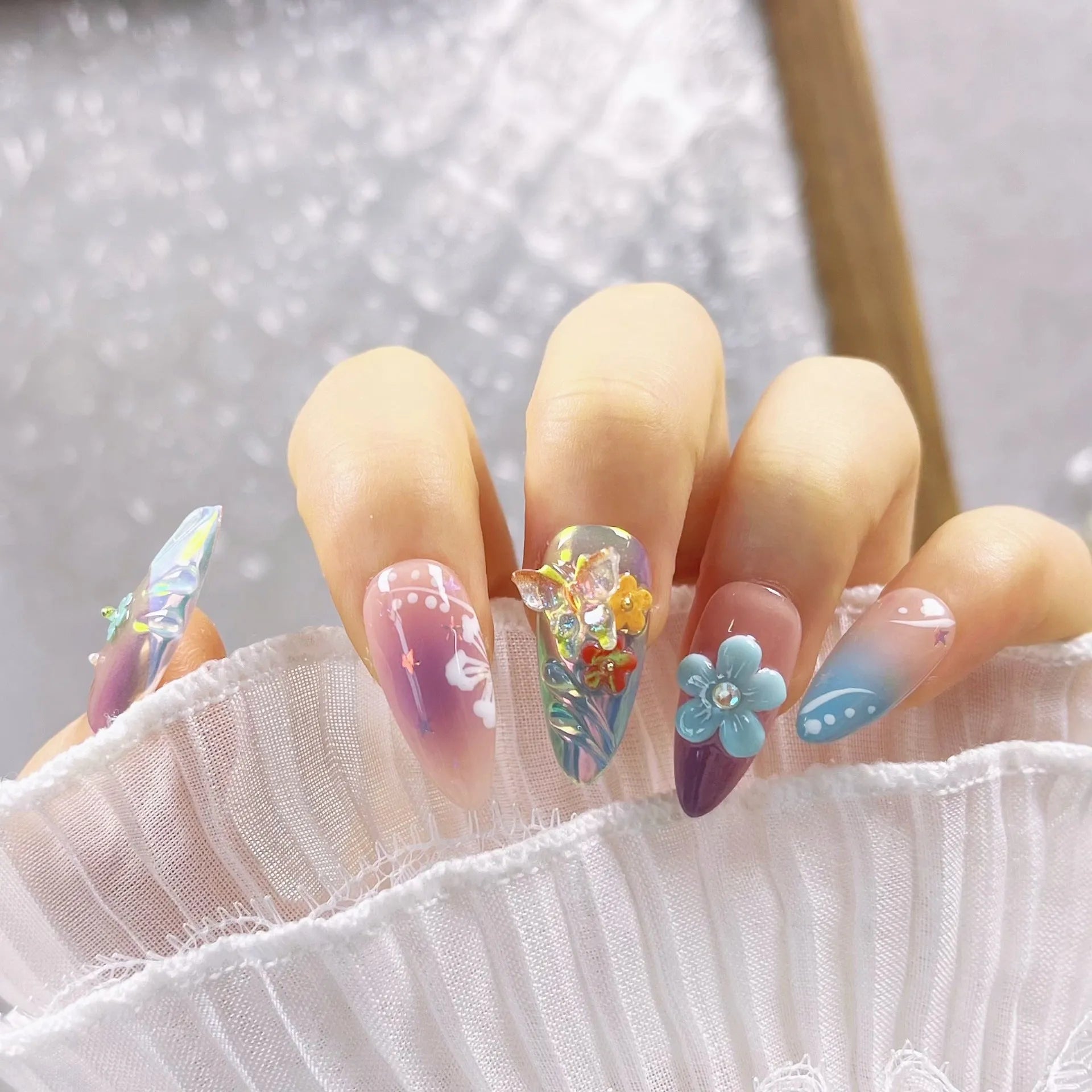 Handmade small flower and butterfly nail art sculptures for three-dimensional manicures