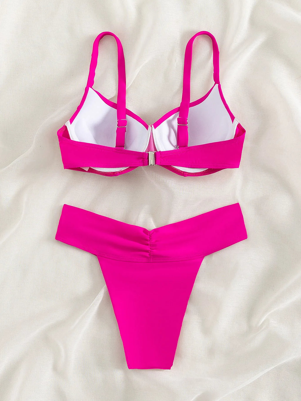 Women's fluorescent solid colour nylon bikini swimsuit on a mannequin.