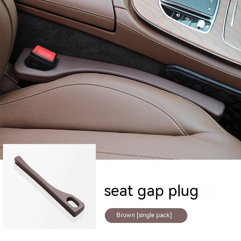 Polyurethane car seat gap filler strip in black colour, shown next to a vehicle centre console.