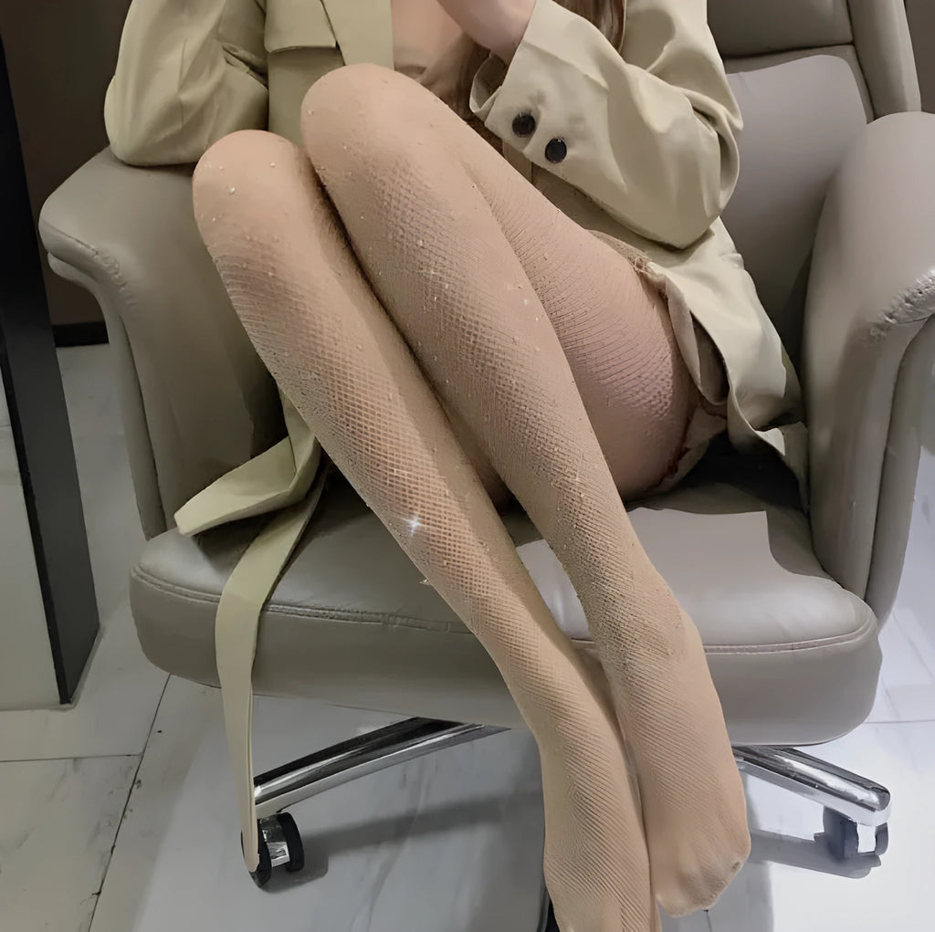 Women's fishnet stockings with diamond mesh pattern in skin colour, black, or white.