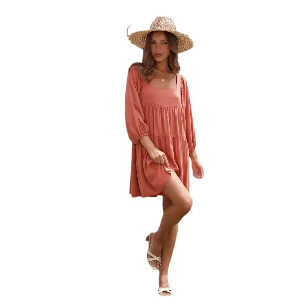 Girl in a light blue square collar puff sleeve backless A-line summer dress.