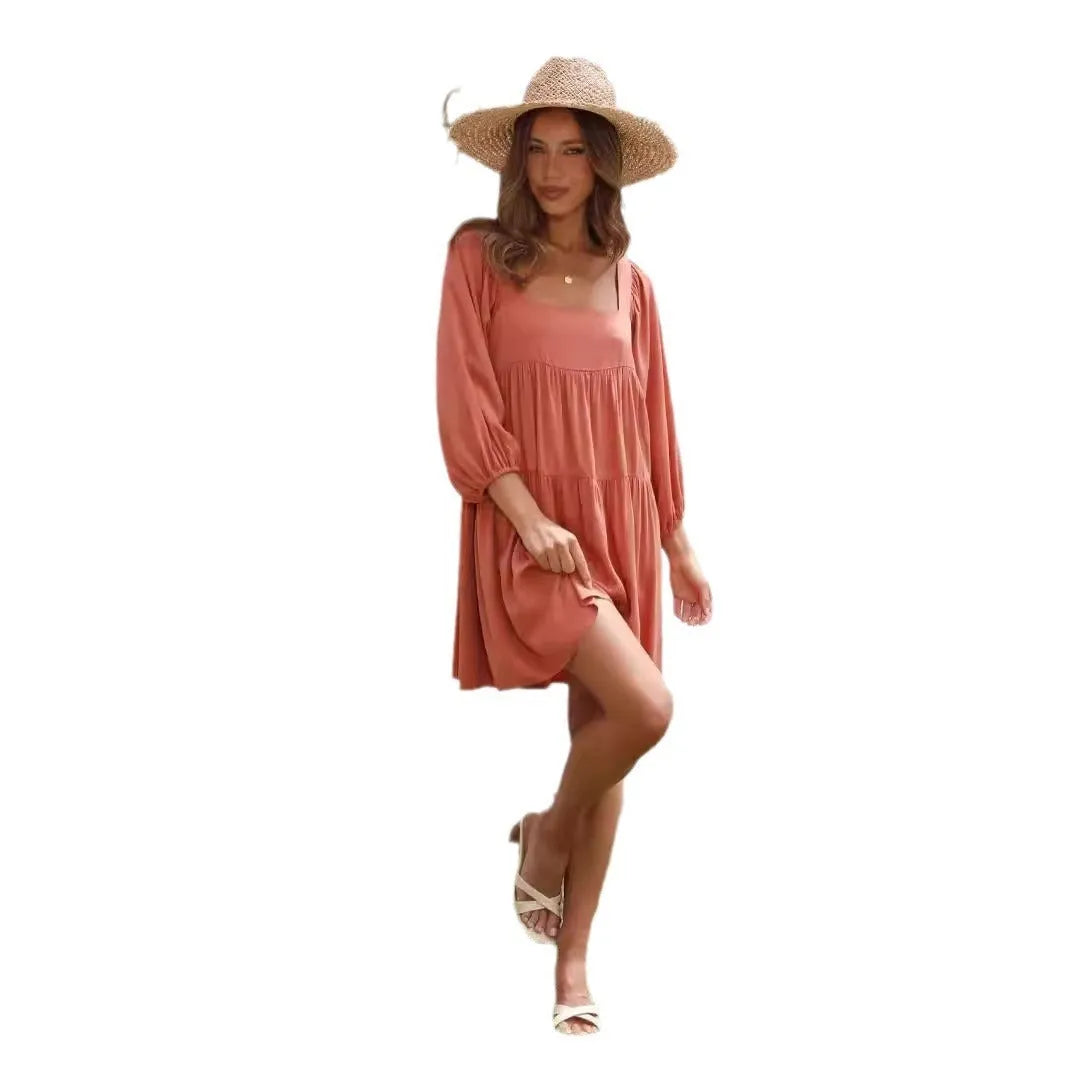 Girl in a light blue square collar puff sleeve backless A-line summer dress.