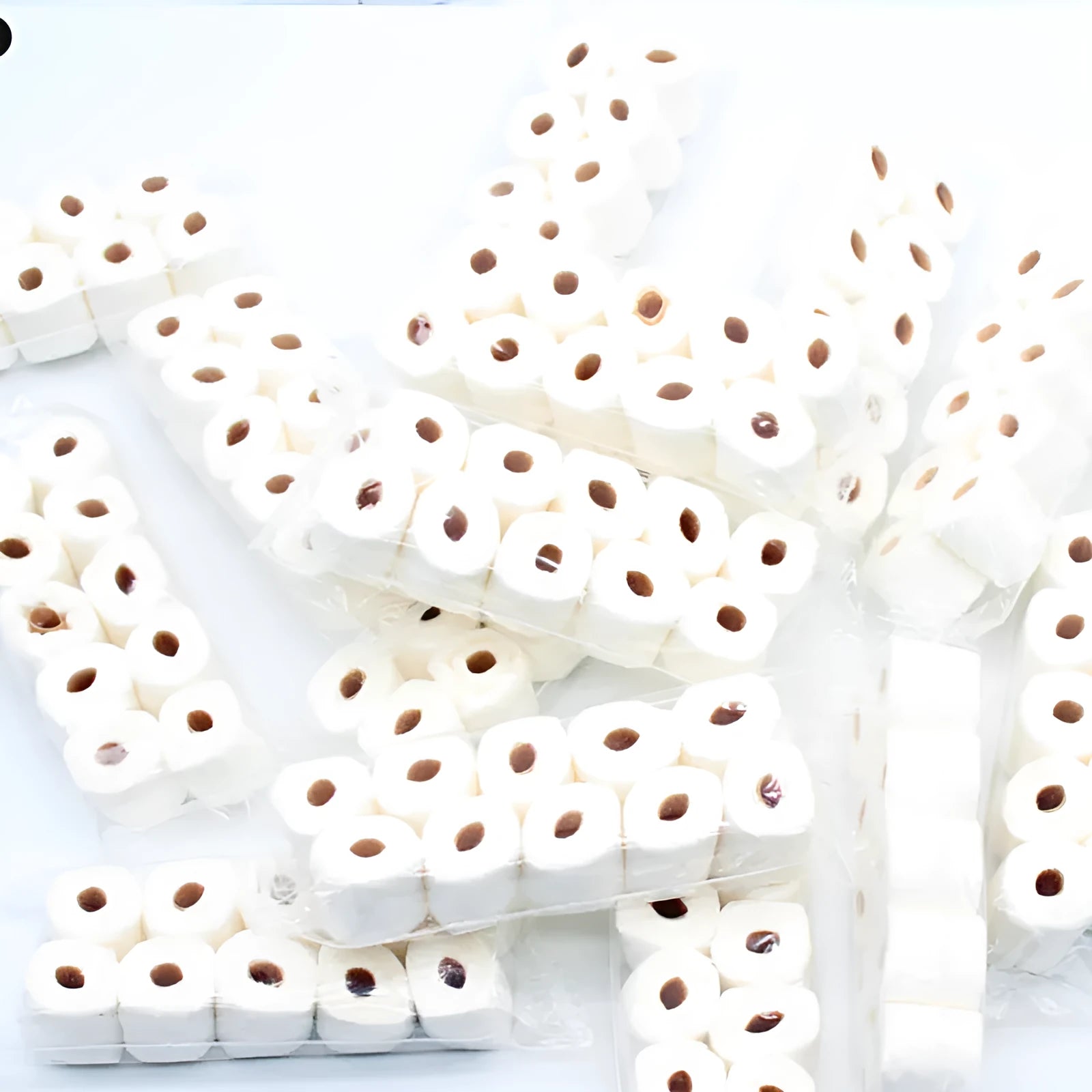 Miniature paper model of a toilet tissue roll for children's pretend play toys.