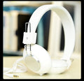 Wired head-mounted sports earphones with microphone in six colour options showing 3.5mm straight plug