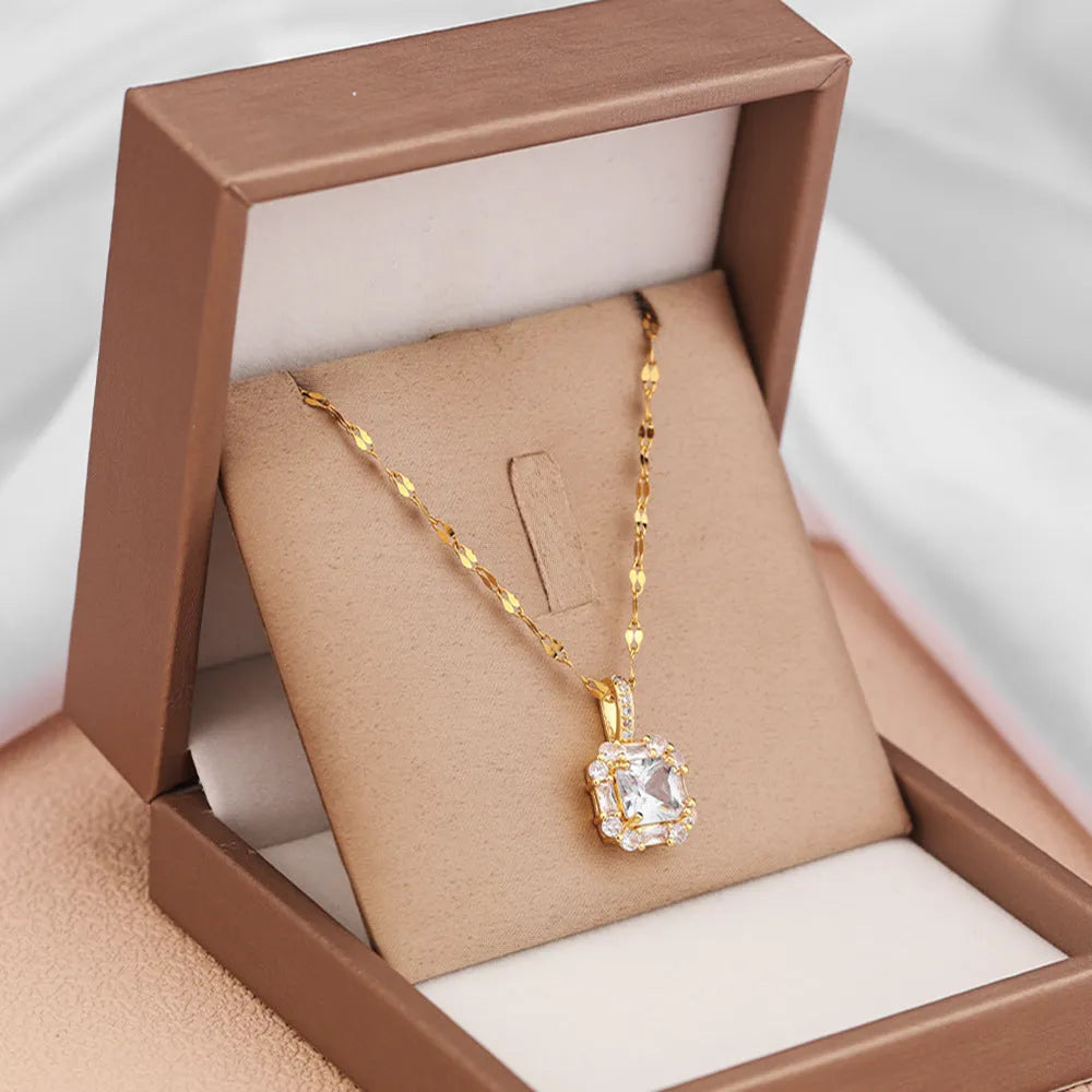 Women's gold geometric pendant necklace with mixed gemstone inlay on water wave chain