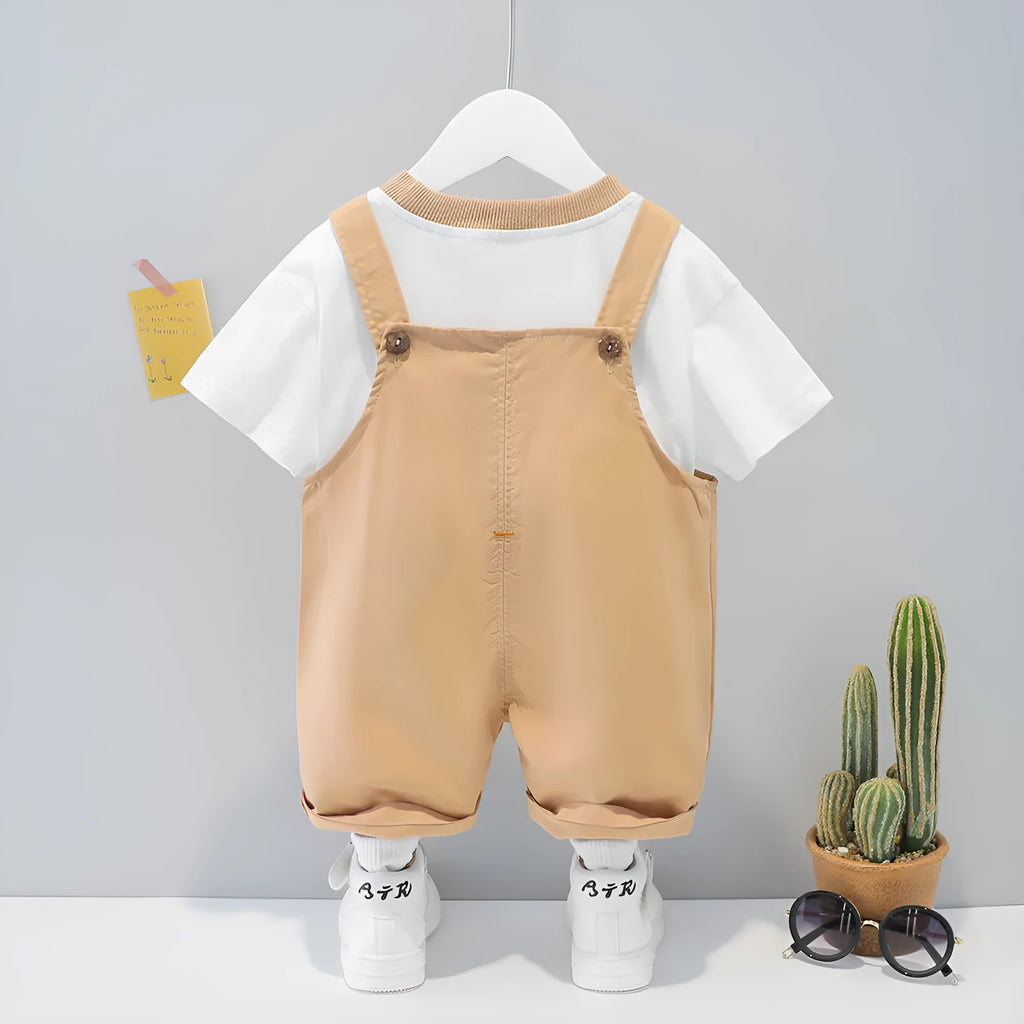 Yellow cartoon print baby overalls with adjustable straps, short sleeves, and an openable front.