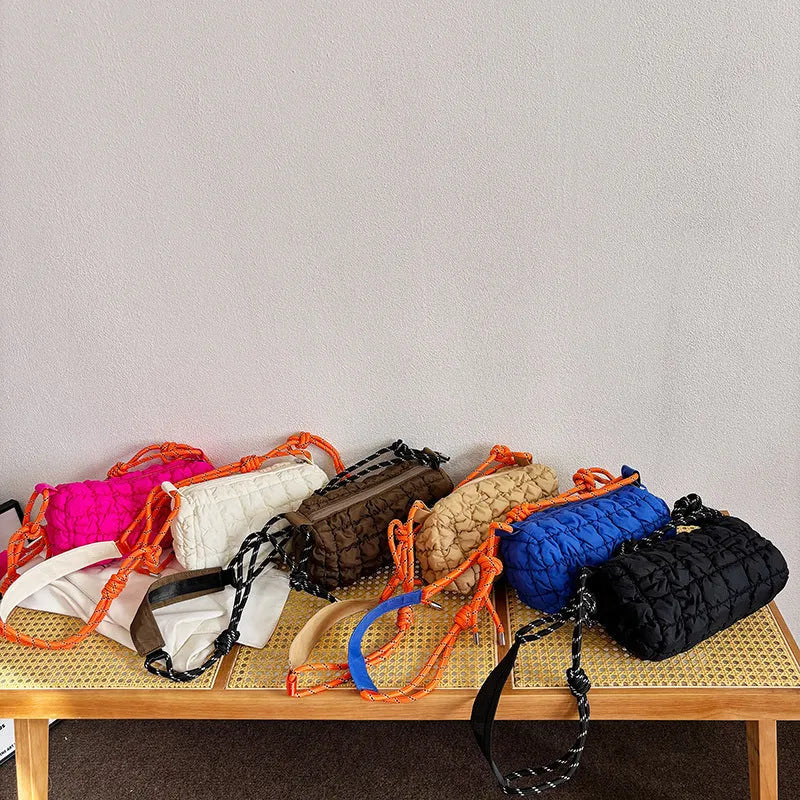Women's soft nylon messenger bag in pillow shape with rhombus pattern and crossbody strap.