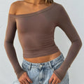 Women's black pure colour knitted cardigan with shoulder strap detail and long sleeves.