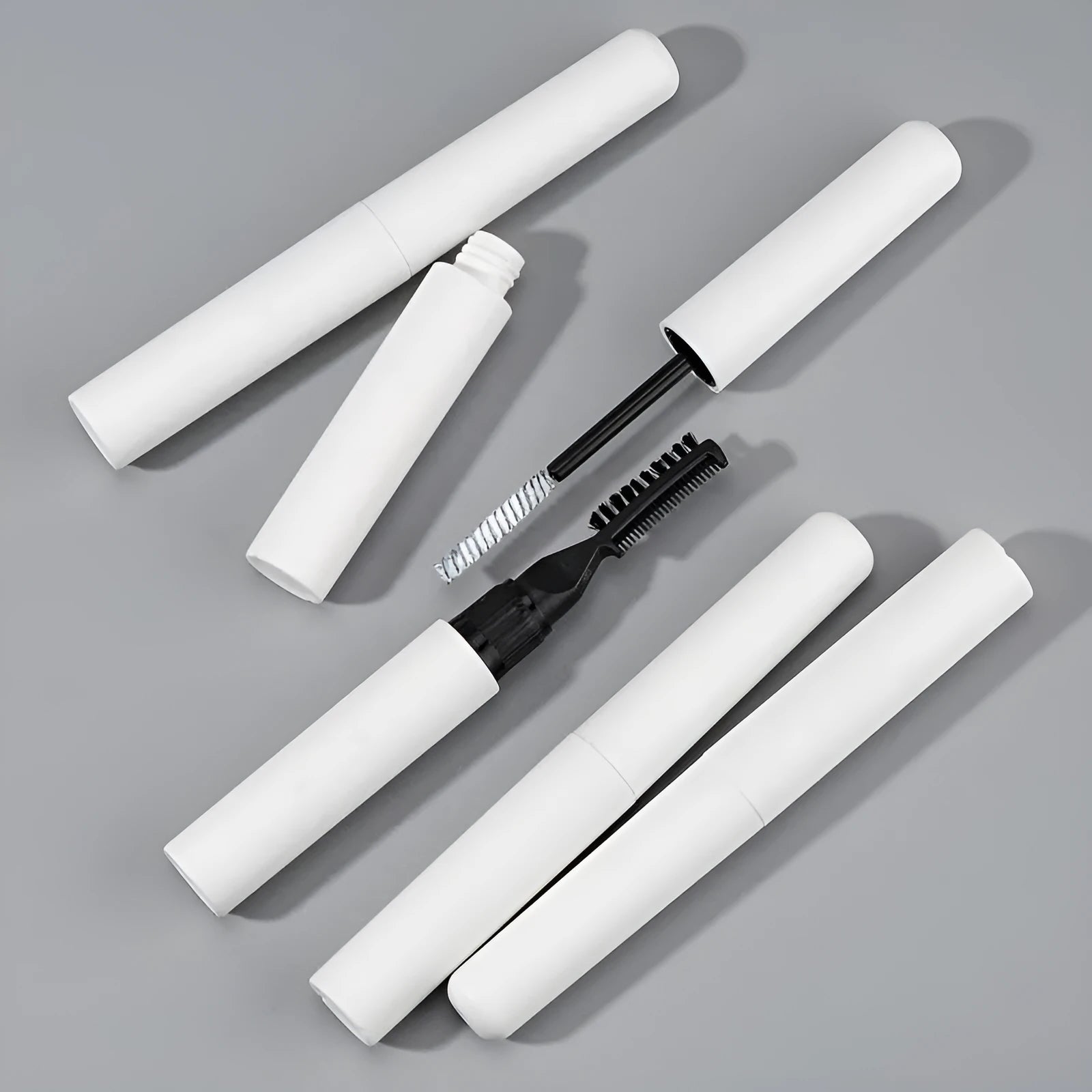 Eyebrow shaping brush with moulding glue for natural eyebrows in white and pink options