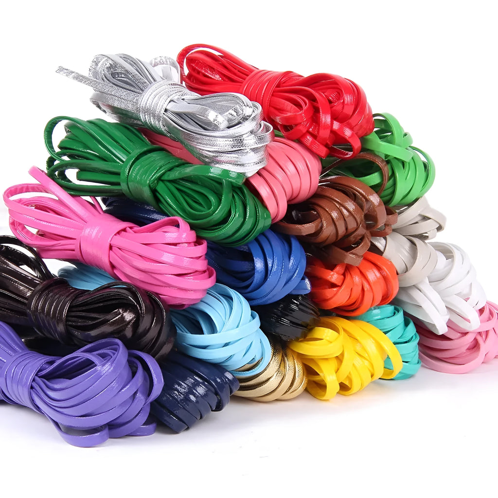 Coils of woven PU leather craft cord in various colours including black, brown, blue, red, and gold.
