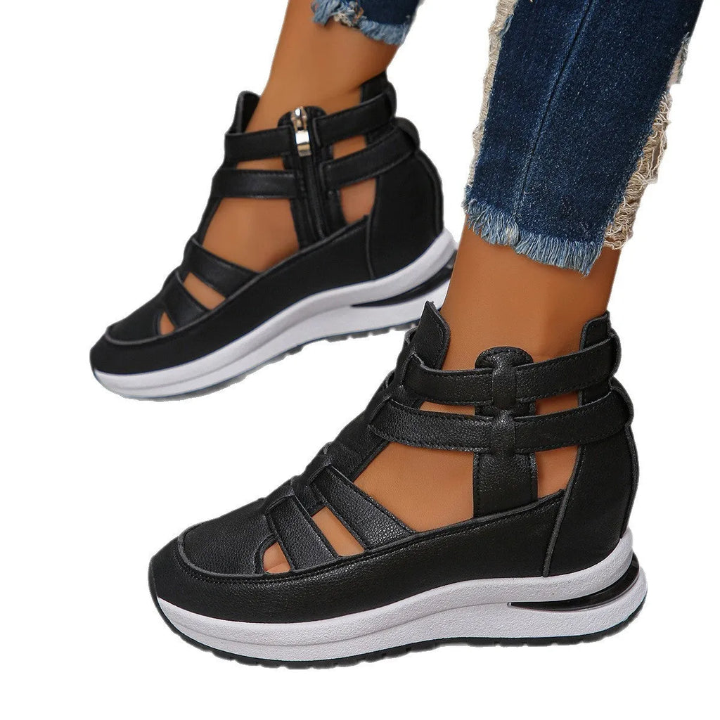 Women's black hollow-out platform sandals with Velcro fastening on a white background