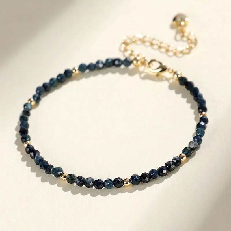 Blue tourmaline beaded bracelet with 3mm stones and spacer bead sections