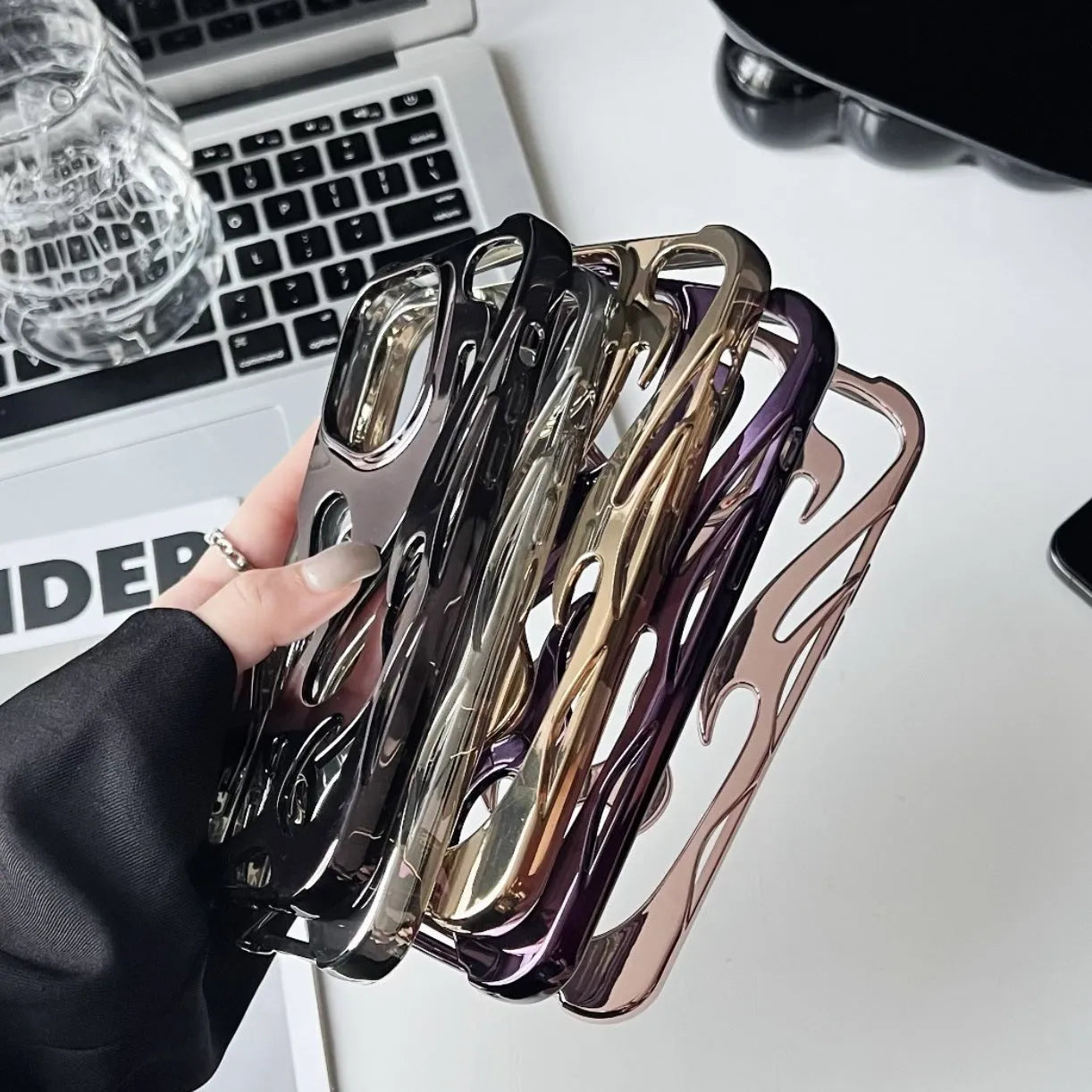 Electroplated hollow flame pattern soft TPU phone case for Apple iPhone in silver finish.