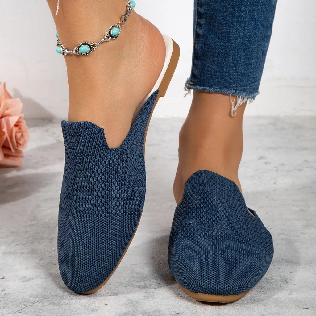 Apricot coloured mesh slip-on sandals with round toe and flat rubber sole on a white background.