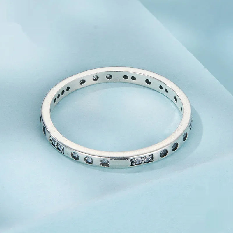 Sterling silver 'I Love You' Morse code ring with black oxidised finish on a plain background.