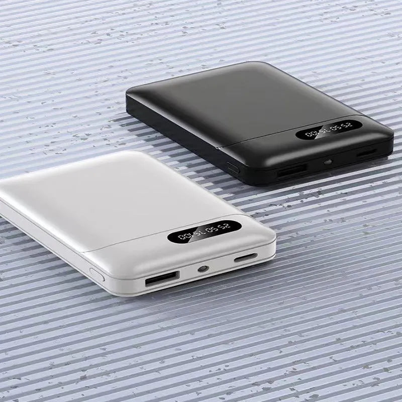 White or black portable power bank with 10000 mAh capacity measuring 92mm by 63mm