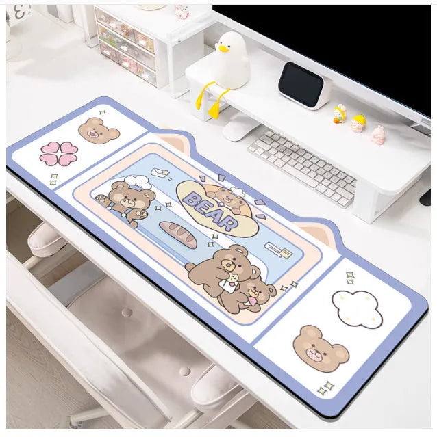 Natural rubber oversized desk pad showing pink bunny, purple bear, and purple kitten colour options