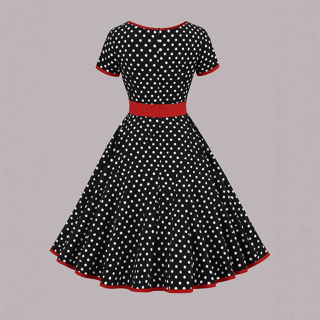 Women's multicolor polka dot dress with square collar, short sleeves, front zipper, and pleated mid-length skirt.