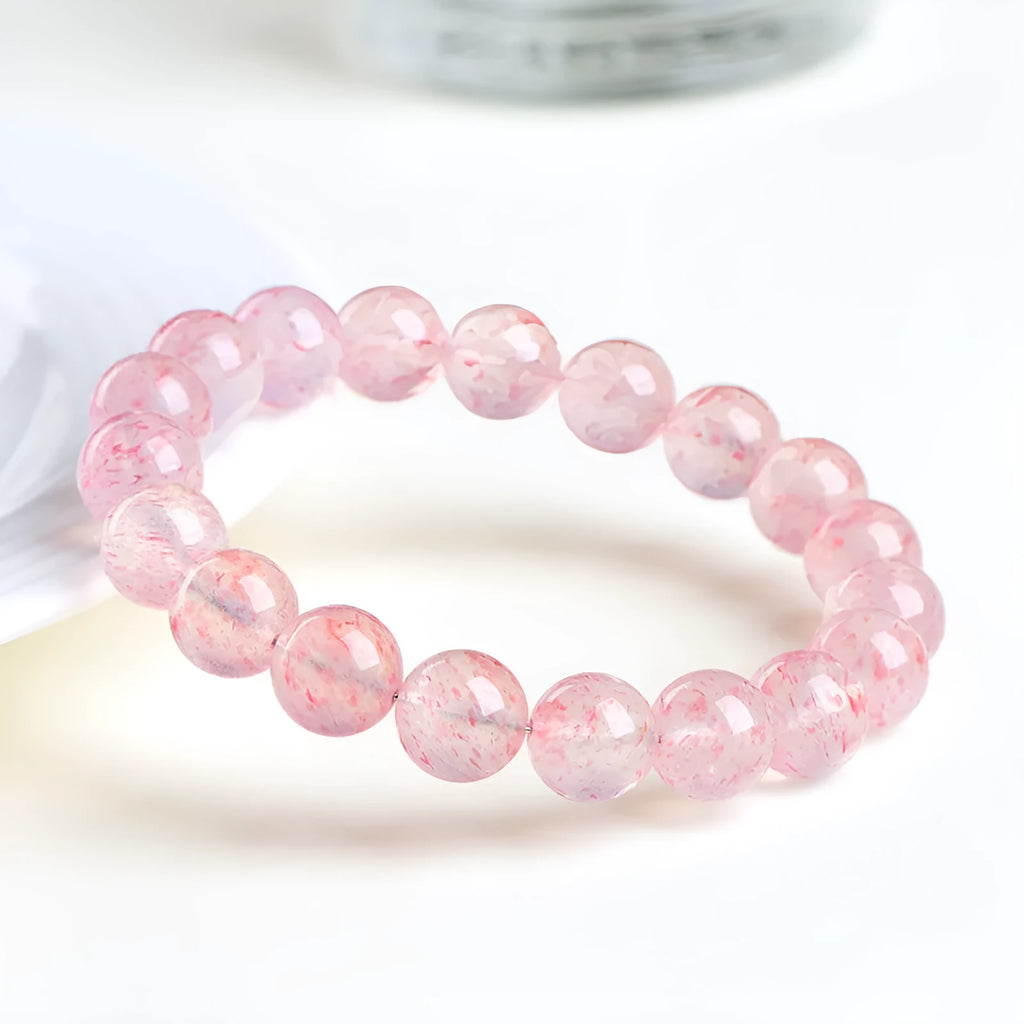 Strawberry quartz crystal bracelet with 10mm polished beads on elastic string