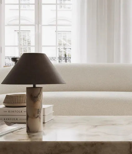Black modern marble table lamp with minimalist design on wooden surface