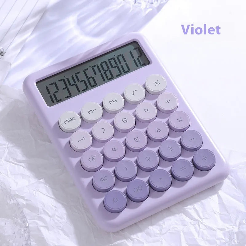 Gradient colour desk calculator in violet, cherry blossom pink, glacier blue, and mint green on a white desk.