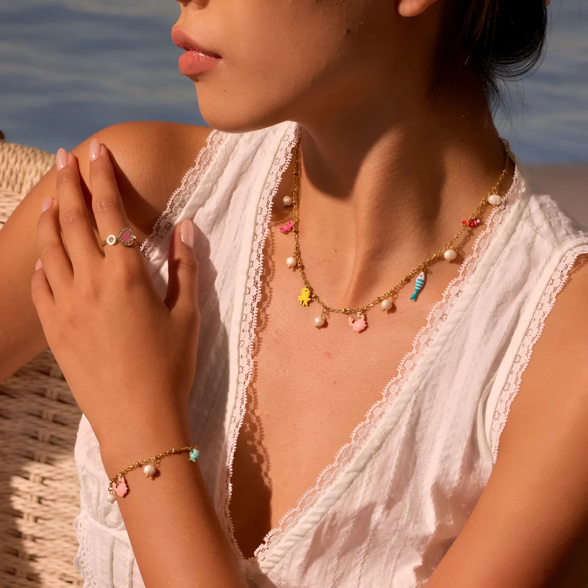 Stainless steel pendant necklace with geometric shape and 18K gold electroplating, paired with a titanium steel bracelet, for women