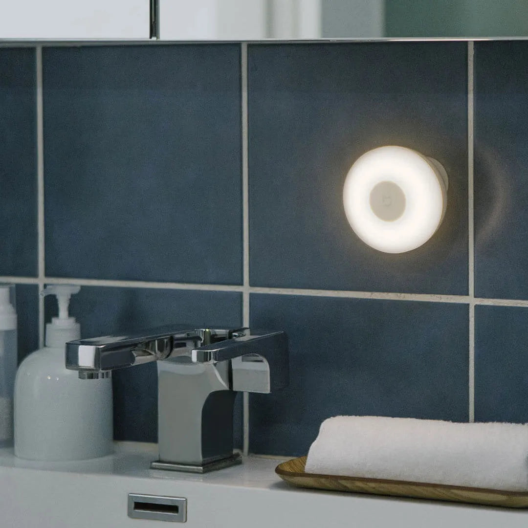 White square Mijia Bluetooth bedside table lamp with motion sensor on a wooden nightstand.