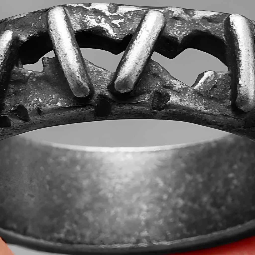Stainless steel double ring with punk stitch patterning in dark colour, showing layered design