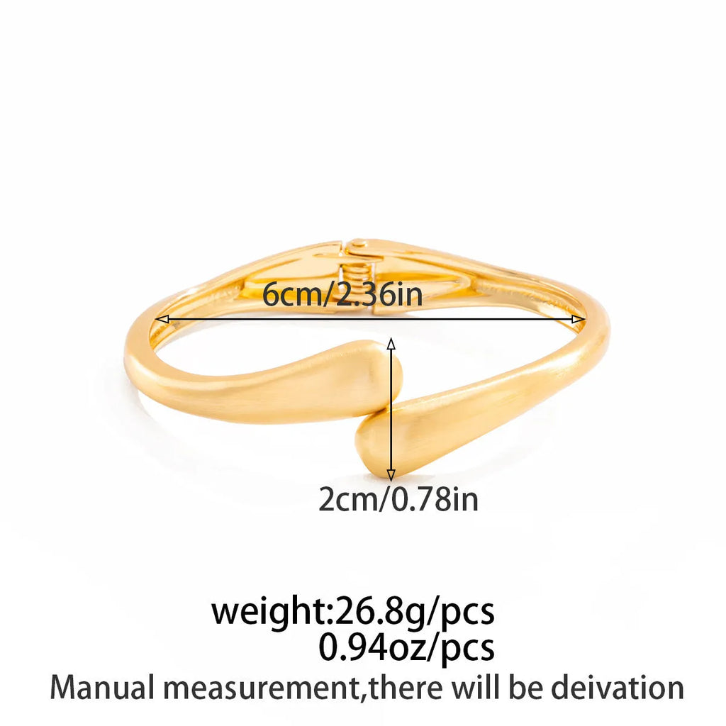 Alloy opening bracelet ellipse shape electroplated finish matte gold colour cold wind style