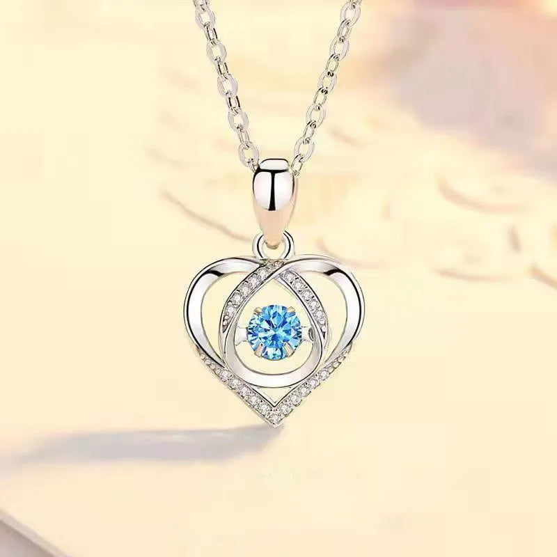 Blue heart-shaped necklace and bracelet set with mixed gem inlay on geometric pendant