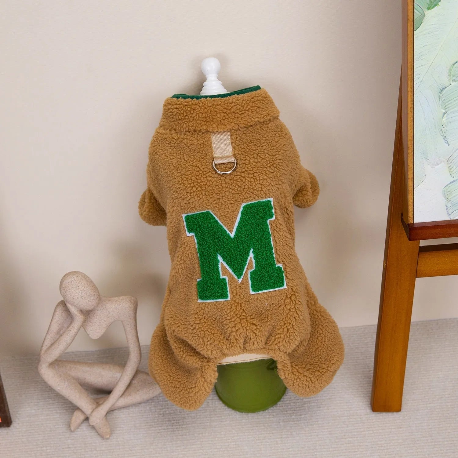 Four legs fluffy jacket pet clothing in beige colour on a small dog, polyester fabric, casual style.