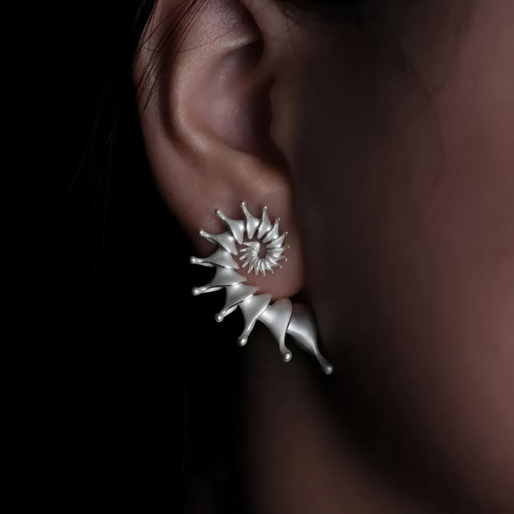 Matte finish conch stud earrings with exaggerated three-dimensional alloy design