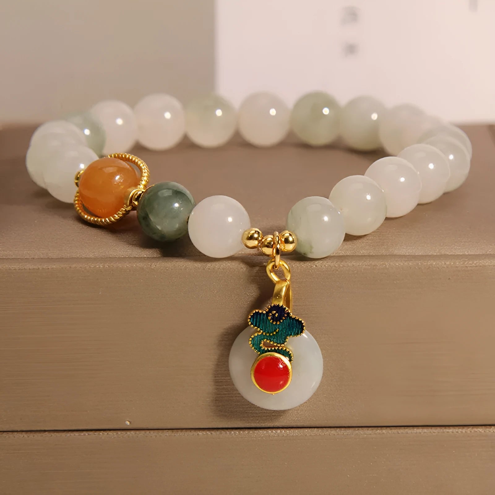 Ice jade women's bracelet with xiangyun peace jade buckle and pearl detailing