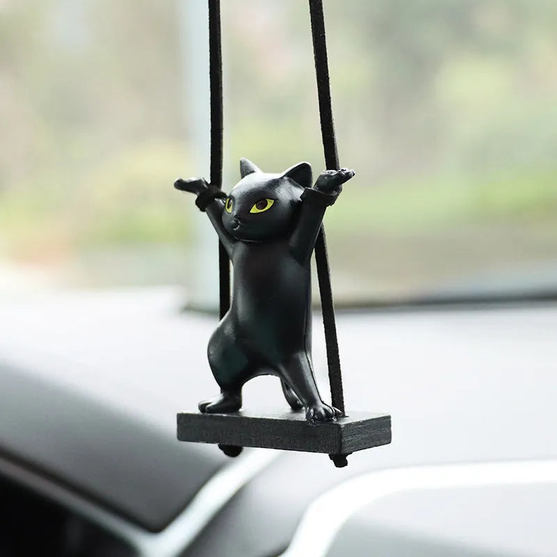 Cartoon-style resin cat pendant on an adjustable rope for car interior decoration.