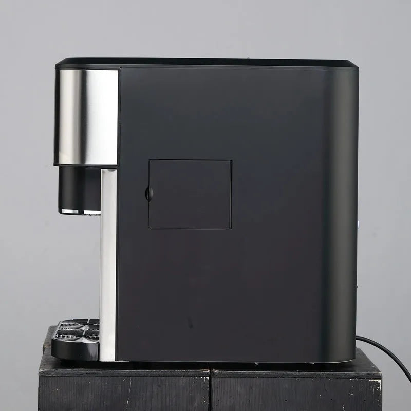 Black desktop ice maker with stainless steel interior showing ice crushing and water dispensing functions