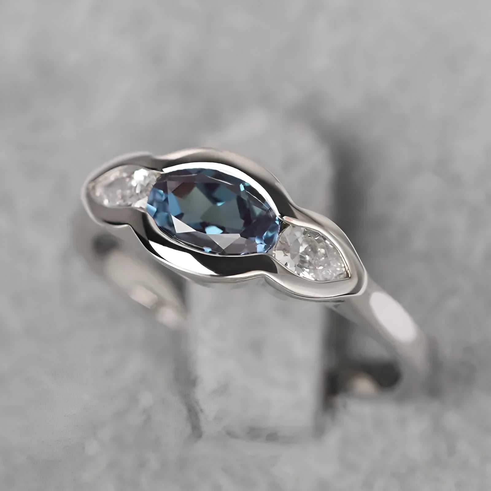 Geometric ellipse zircon ring in white gold colour showing contemporary design