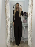 Black loose fit casual two-piece lounge set with long sleeve top and trousers on a hanger.