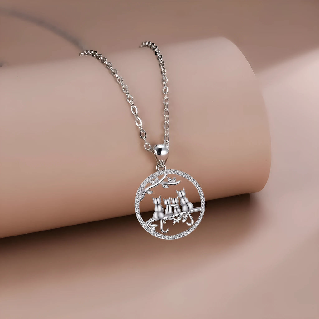 Copper necklace with four kitten pendant design on cross chain style
