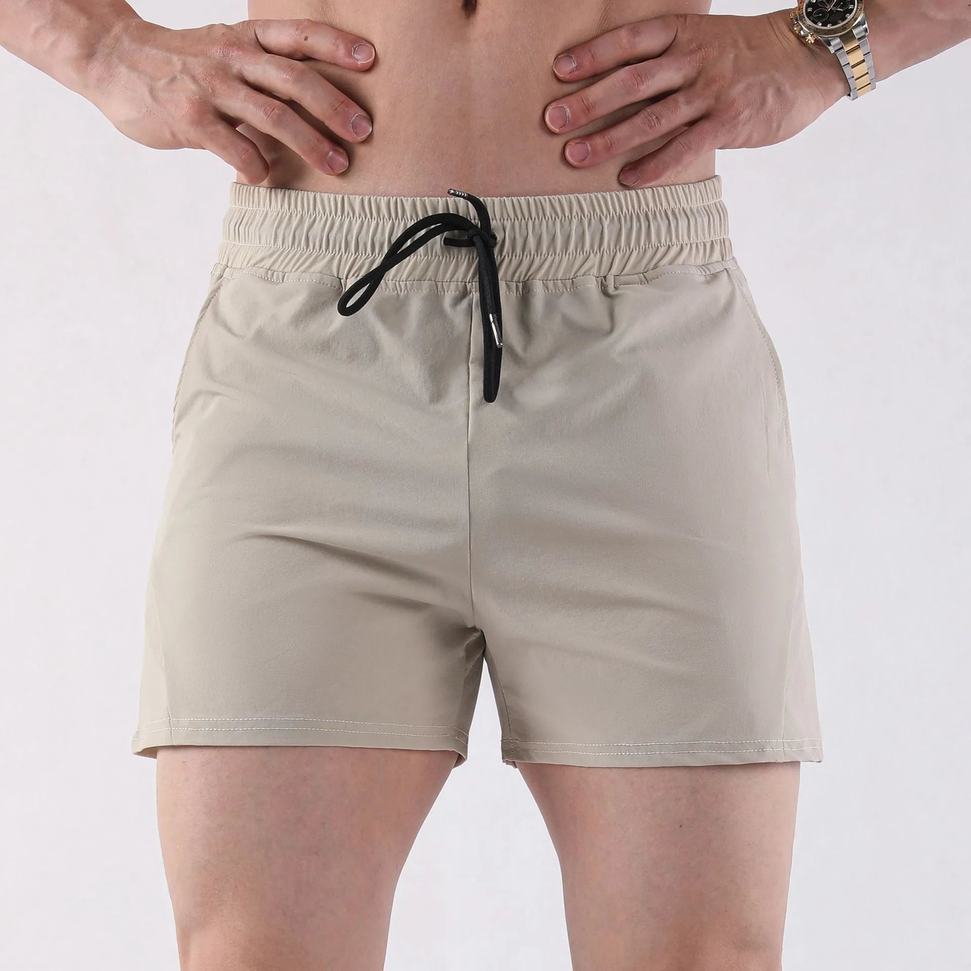 Men's thin grey polyester basketball shorts with elastic waistband, shown flat.