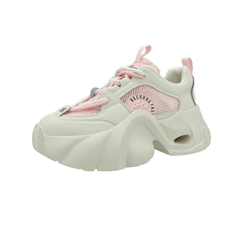 Women's beige platform sneakers with crossover ankle straps and a thick rubber sole.