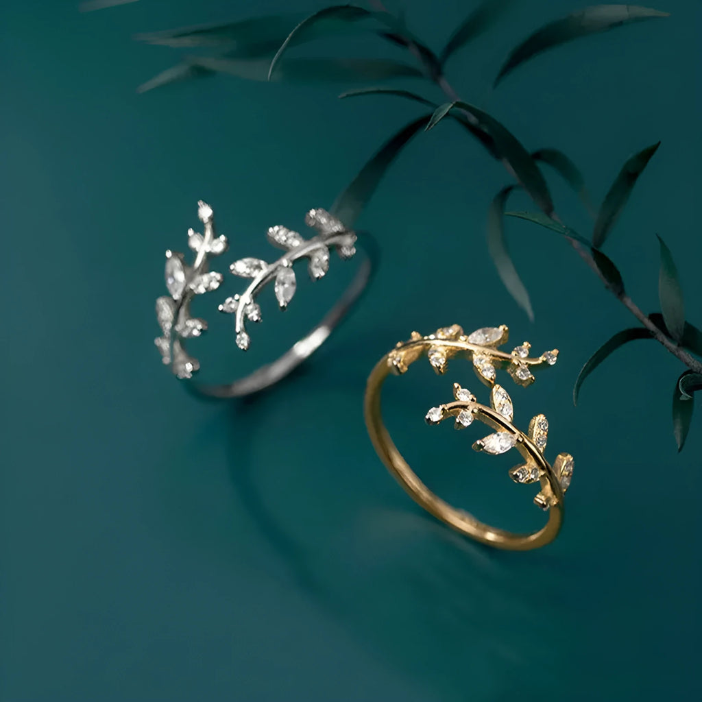 Women's leaf design copper fashion ring with geometric elements and electroplated silver or gold finish