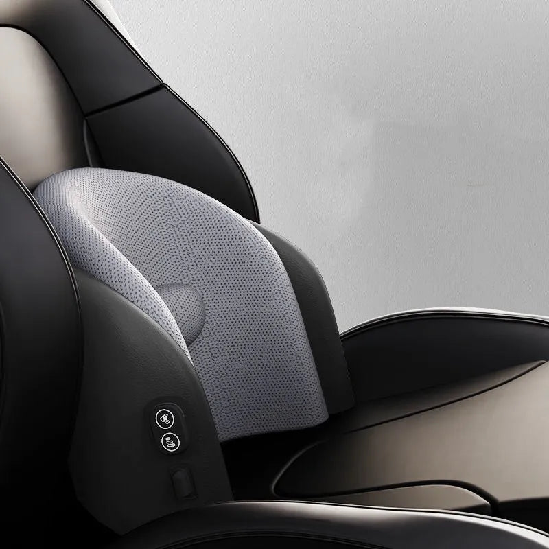 A black car massage cushion with electric vibration controls, placed on a car seat for neck and lumbar support.