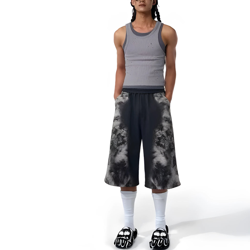 Three-piece streetwear co-ord set showing hoodie, loose trousers and seven-inch shorts with printed collage design