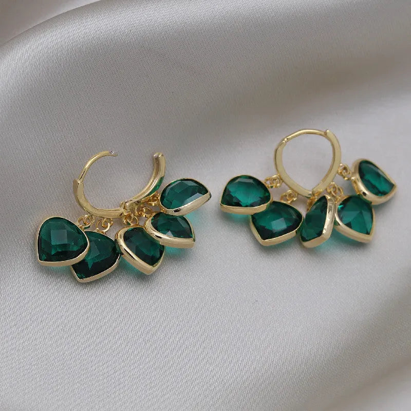 Green heart-shaped clip earrings with alloy inlaid gemstone details in Korean style