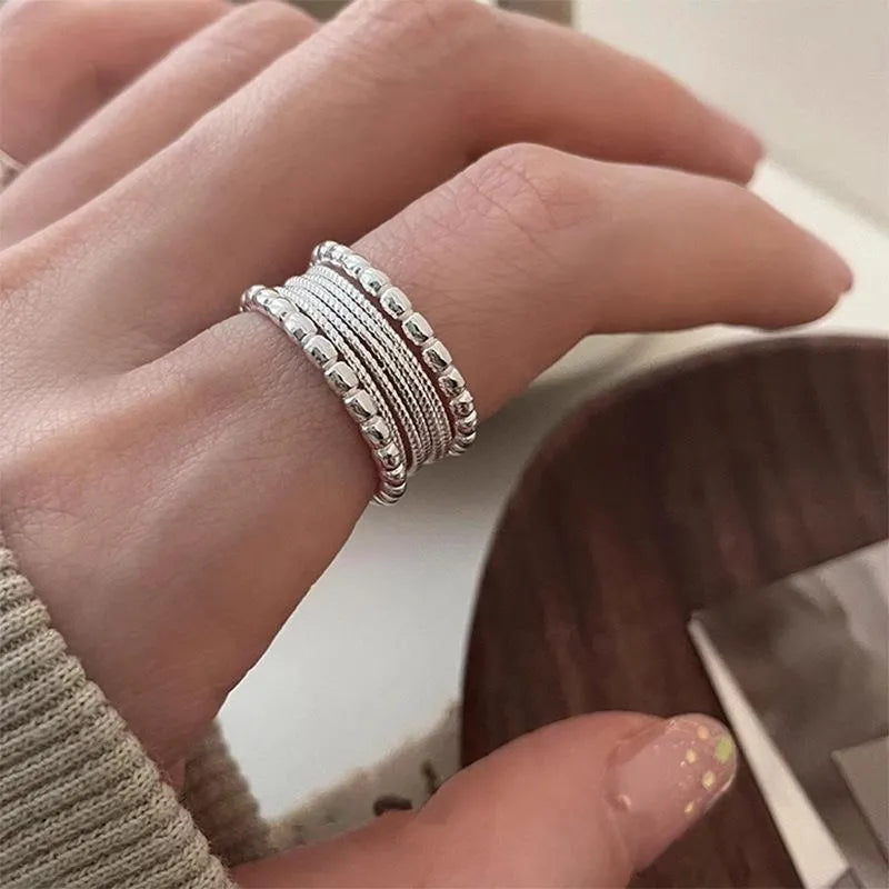 Women's adjustable geometric copper ring with woven twisted multilayer design