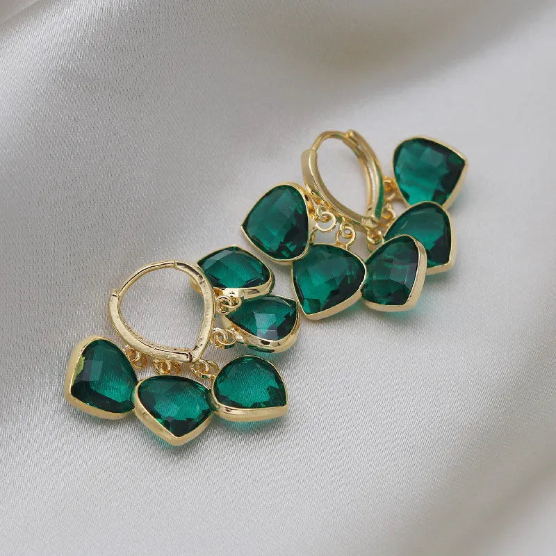 Green heart-shaped clip earrings with alloy inlaid gemstone details in Korean style